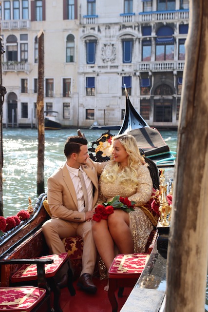 couple inside the gondola in Venice Italy
